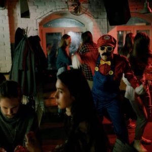 Many people dressed up at a costume party.