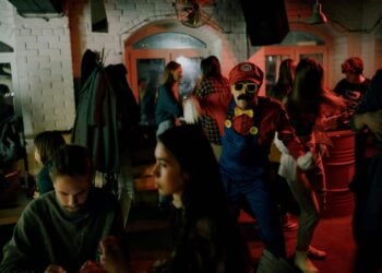 Many people dressed up at a costume party.