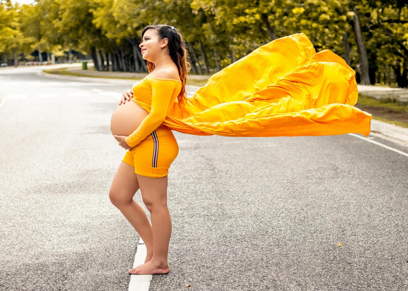 Woman wearing a pregnant cosplay of Kill Bill