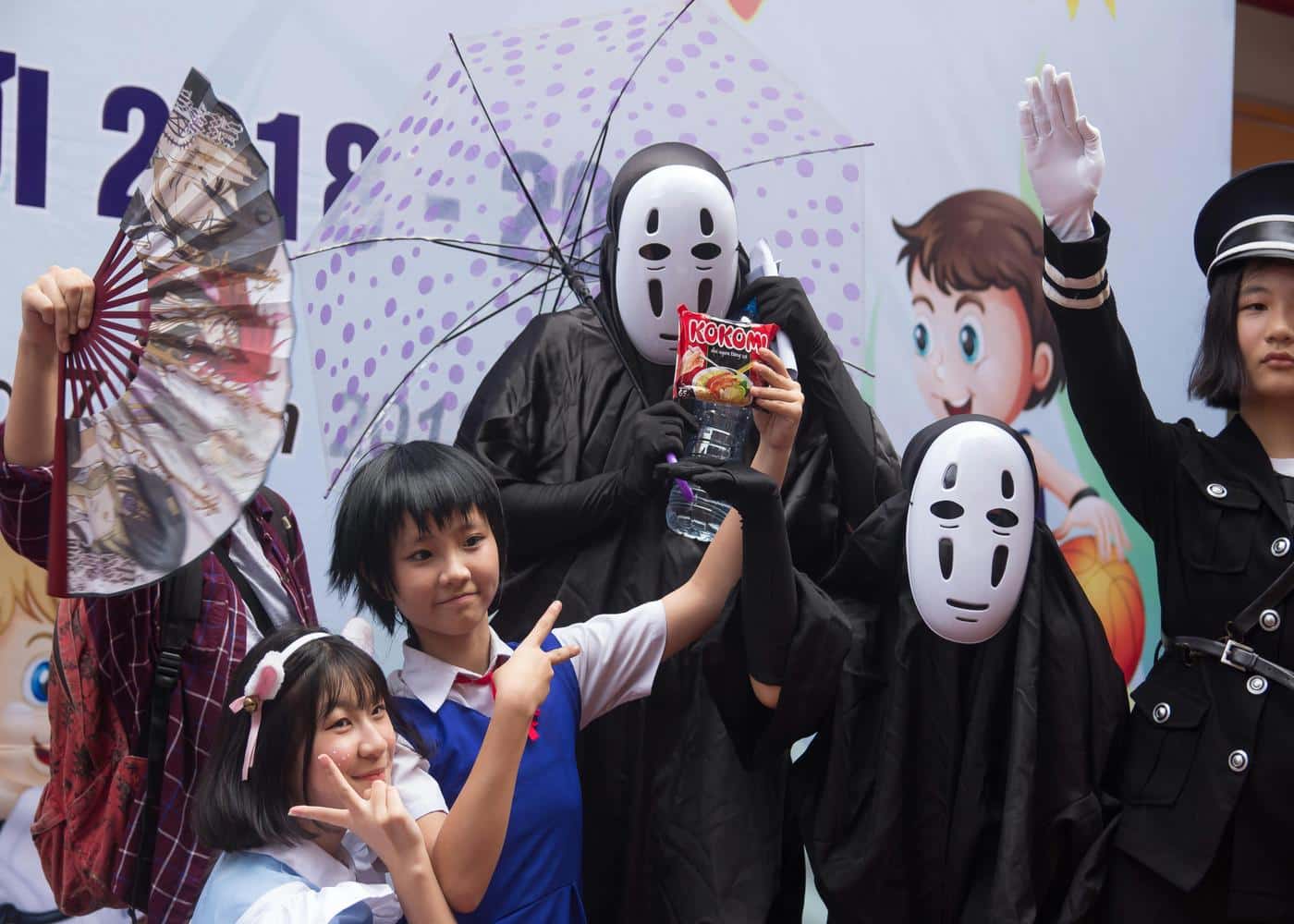 Group of fans cosplaying at an anime event