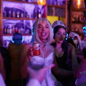 Women at a fancy dress party in a crowded bar