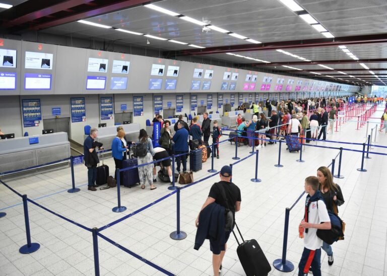 Fancy dress at airport: Image of a busy check-in
