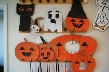 Handmade cardboard Halloween pumpkins, ghosts and a black cat