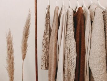 Everyday shirts and knitwear hanging on a clothing rail