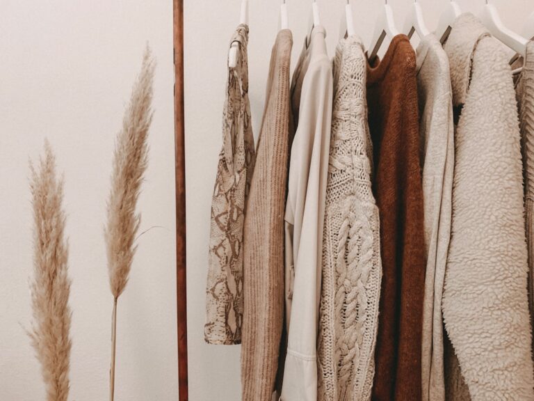 Everyday shirts and knitwear hanging on a clothing rail