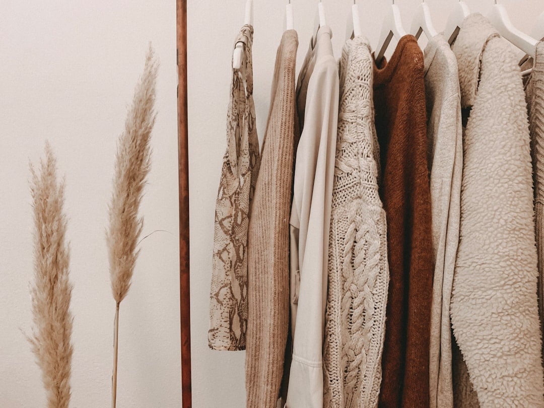 Everyday shirts and knitwear hanging on a clothing rail